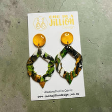 Load image into Gallery viewer, One in a Jillion Design handcrafted statement dangle earrings featuring a marbled green, white, and gold geometric shape.